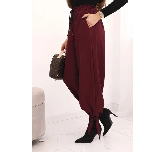Dámské kalhoty s širokým nohavicí a zavazováním dole bordové