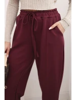 Elegantní dámské kalhoty s vysokým pasem a vázáním v pase bordó Elegantní dámské kalhoty s vysokým pasem a vázáním v pase bordó