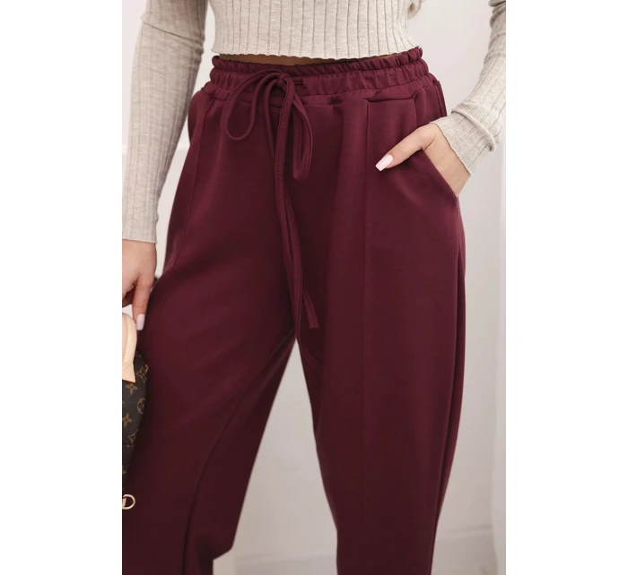 Elegantní dámské kalhoty s vysokým pasem a vázáním v pase bordó Elegantní dámské kalhoty s vysokým pasem a vázáním v pase bordó