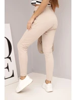 Dámské tepláky s elastickým pasem a šňůrkou béžové Dámské tepláky s elastickým pasem a šňůrkou béžové