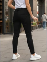 Černé dámské kalhoty FashionStreet s dírou UY2857 Černé dámské kalhoty FashionStreet s dírou UY2857