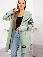 Pláštěnka světle mátové barvy s nápisy