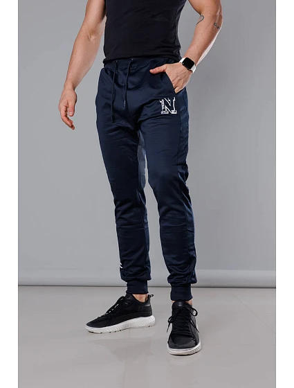 Tmavě modré pánské teplákové kalhoty s potiskem model 18347905 - J.STYLE Tmavě modré pánské teplákové kalhoty s potiskem model 18347905 - J.STYLE