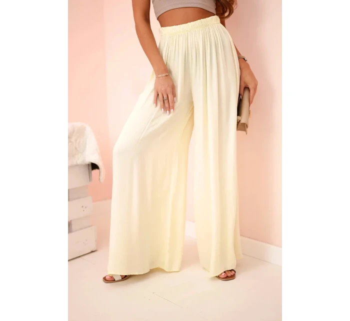 Široké dámské kalhoty s elastickým pasem žlutý