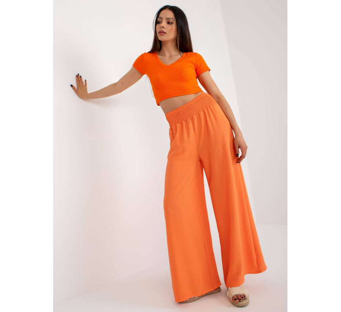 Oranžové široké dámské kalhoty s gumou v pase (8390)