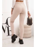 Dámské kalhoty z bavlny s roztržením a gumou v pase béžové