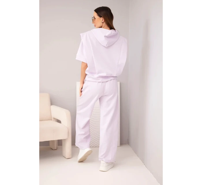 Dámský komplet model 22022727 mikina s kapucí a volné kalhoty se zavazováním světle fialová - K-Fashion Dámský komplet model 22022727 mikina s kapucí a volné kalhoty se zavazováním světle fialová - K-Fashion