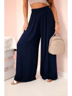 Široké dámské viskózové kalhoty s elastickým pasem tmavě modré Široké dámské viskózové kalhoty s elastickým pasem tmavě modré