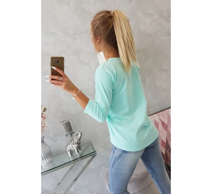 Halenka s 3D grafikou hodinek v mátové barvě Halenka s 3D grafikou hodinek v mátové barvě