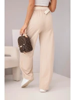 Dámské bavlněné kalhoty se širokou nohavicí a páskem béžové Dámské bavlněné kalhoty se širokou nohavicí a páskem béžové