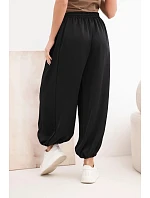 Dámské široké kalhoty s gumou v pase a vázáním ve stylu model 22064413 černé - K-Fashion