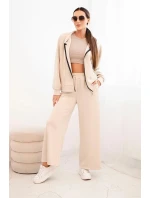 Dámský komplet máslový s širokými nohavicemi a mikinou na zip béžový Dámský komplet máslový s širokými nohavicemi a mikinou na zip béžový