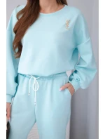 Dámský komplet máslová mikina s broží a kalhoty s rovnými nohavicemi model 22030082 - K-Fashion