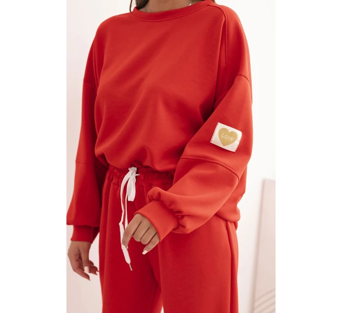 Dámský komplet máslový s volnou mikinou a kalhotami s nápisem LOVE červený Dámský komplet máslový s volnou mikinou a kalhotami s nápisem LOVE červený