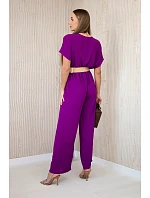 Kombinéza s ozdobným páskem v pase tmavě fialová