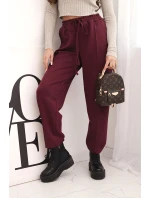 Elegantní dámské kalhoty s vysokým pasem a vázáním v pase bordó Elegantní dámské kalhoty s vysokým pasem a vázáním v pase bordó