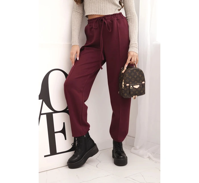 Elegantní dámské kalhoty s vysokým pasem a vázáním v pase bordó Elegantní dámské kalhoty s vysokým pasem a vázáním v pase bordó