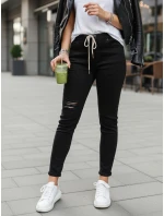 Černé dámské kalhoty FashionStreet s dírou UY2857 Černé dámské kalhoty FashionStreet s dírou UY2857