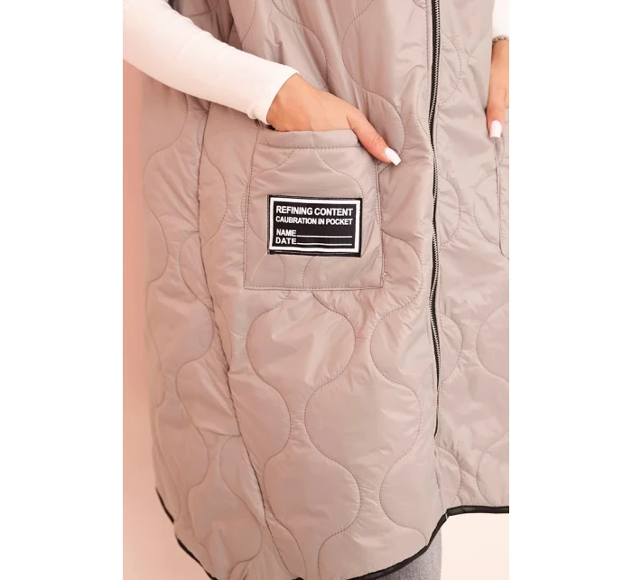 Dámská prošívaná vesta světle béžová - Kesi Dámská prošívaná vesta světle béžová - Kesi