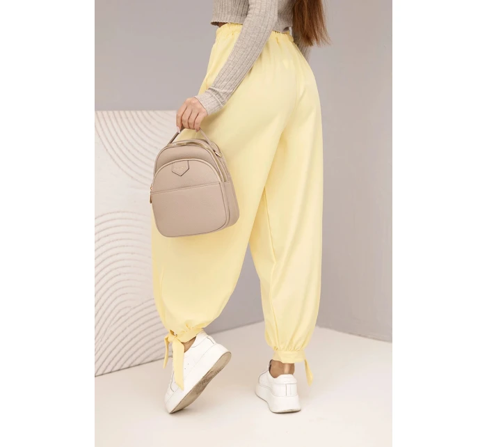 Dámské kalhoty s širokým nohavicím a zavazováním dole žluté