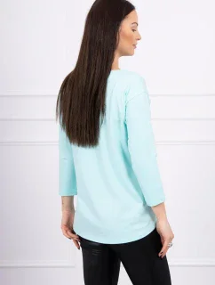 Halenka s 3D grafikou plameňáka v mátové barvě