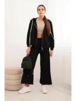 Dámská souprava model 21407227 s širokými nohavicemi a mikinou na zip černý - K-Fashion Dámská souprava model 21407227 s širokými nohavicemi a mikinou na zip černý - K-Fashion