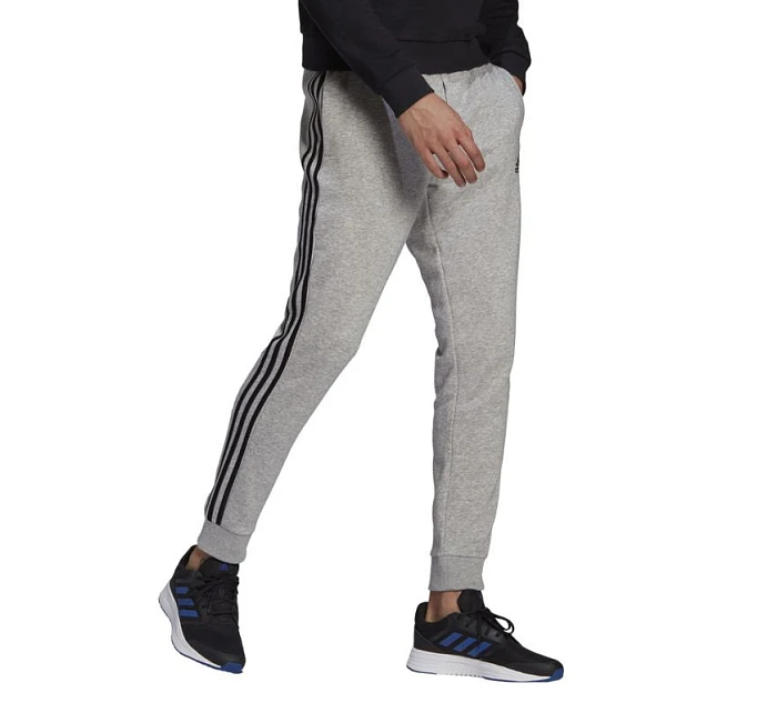 Pánské kalhoty Essentials Fleece M model 16053227 - ADIDAS Pánské kalhoty Essentials Fleece M model 16053227 - ADIDAS