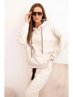 Komplet dámský máslový mikina s kapucí a kalhoty s páskem béžový Komplet dámský máslový mikina s kapucí a kalhoty s páskem béžový