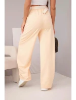 Dámské bavlněné kalhoty se širokou nohavicí a s páskem meruňkové Dámské bavlněné kalhoty se širokou nohavicí a s páskem meruňkové