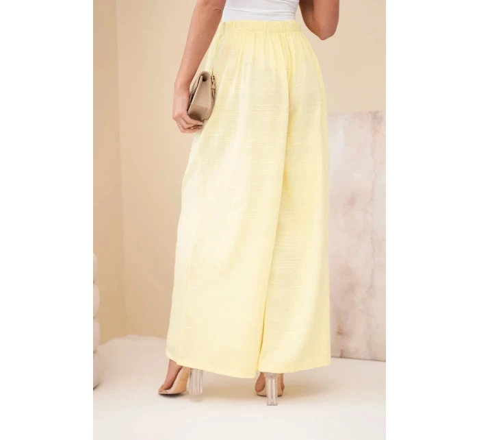 Dámské široké bavlněné kalhoty s gumičkou v pase žluté Dámské široké bavlněné kalhoty s gumičkou v pase žluté