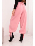 Dámské kalhoty s širokým nohavicí a vázáním dole světle růžové Dámské kalhoty s širokým nohavicí a vázáním dole světle růžové