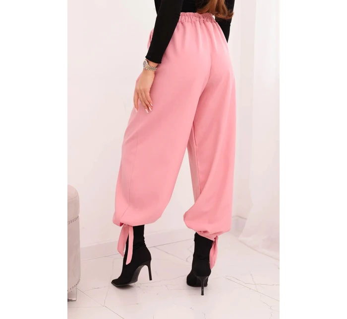 Dámské kalhoty s širokým nohavicí a vázáním dole světle růžové Dámské kalhoty s širokým nohavicí a vázáním dole světle růžové