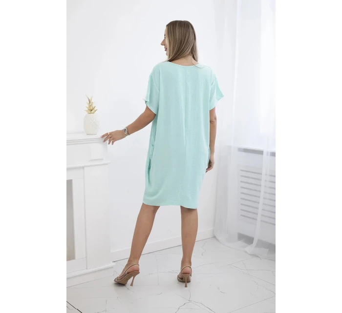 Šaty s kapsami a přívěskem světle mátová