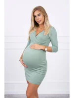 Přiléhavé šaty s průstřihem pod prsy tmavě mátové barvy