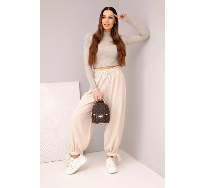 Dámské kalhoty s širokým nohavicí a vázáním dole béžové