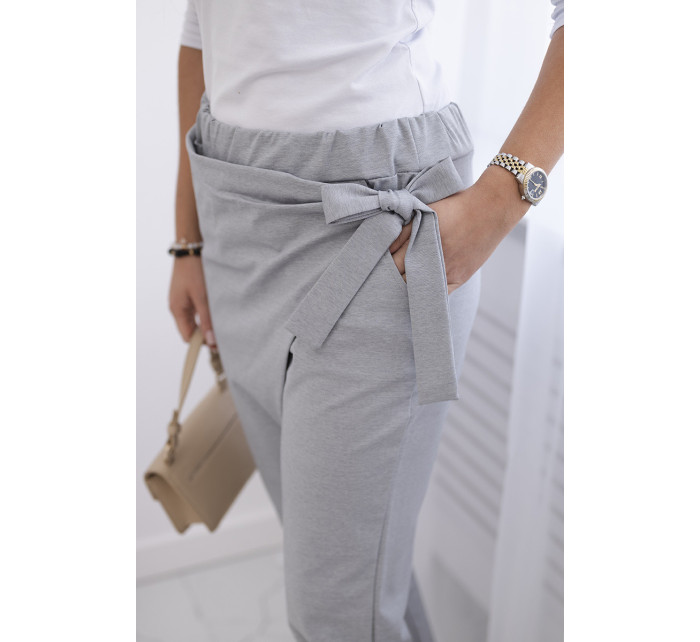 Kalhoty zavazované s asymetrickým předním dílem šedý