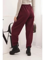 Elegantní dámské kalhoty s vysokým pasem a vázáním v pase bordó Elegantní dámské kalhoty s vysokým pasem a vázáním v pase bordó