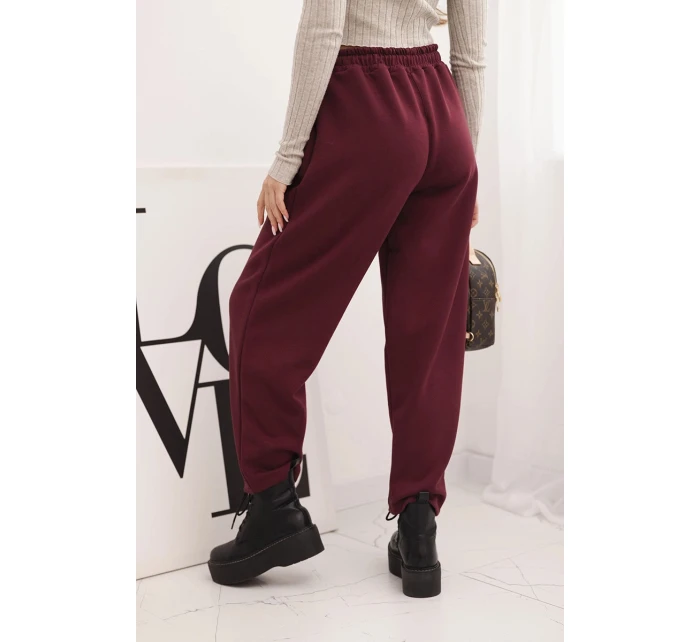 Elegantní dámské kalhoty s vysokým pasem a vázáním v pase bordó Elegantní dámské kalhoty s vysokým pasem a vázáním v pase bordó