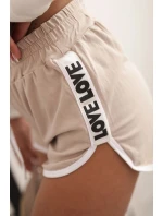 Dámské bavlněné šortky s elastickým pasem a sportovním lemem béžové Dámské bavlněné šortky s elastickým pasem a sportovním lemem béžové