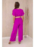 Kombinéza s ozdobným páskem v pase fialová Kombinéza s ozdobným páskem v pase fialová