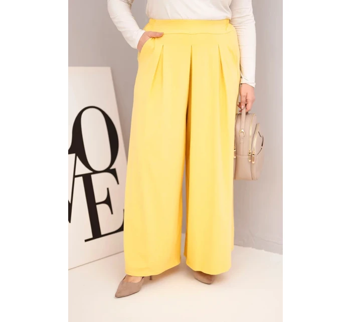 Dámské bavlněné kalhoty Plus Size s širokým střihem a volným střihem žluté Dámské bavlněné kalhoty Plus Size s širokým střihem a volným střihem žluté