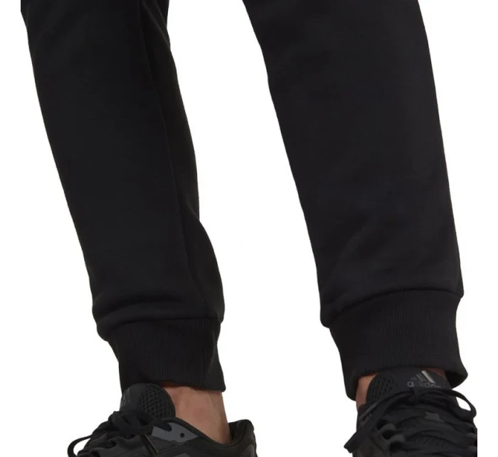 Fleecové kalhoty adidas Essentials Camo Print M HL6929