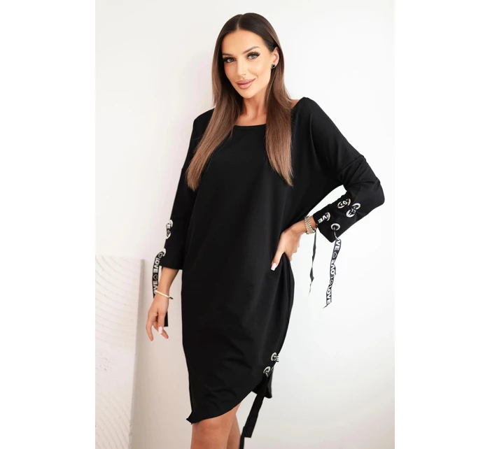 Dámská asymetrická šaty s ozdobnými model 21413453 a rukávem 3/4 modrá - K-Fashion