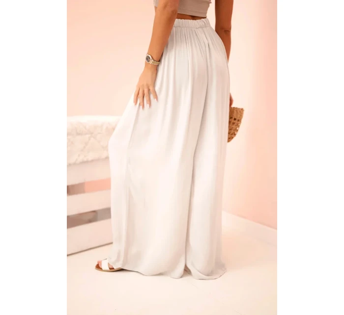 Široké dámské kalhoty s elastickým pasem béžový